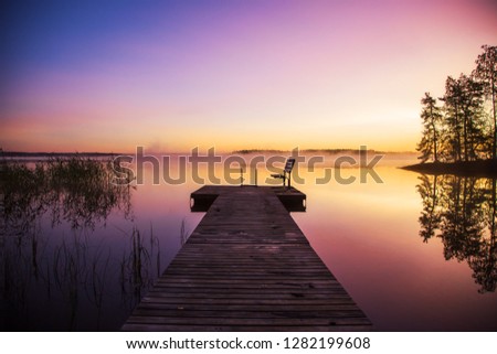 Peaceful sunrise on a lake in Finland
