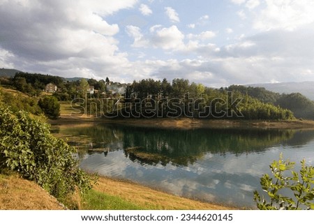 The peacefull lake and islands of Rama lake in Bosnia and Herzegovina with clear water reflection