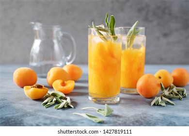 Peach Or Apricot Nectar With Sage In A Glass. Refreshing Cold Drink