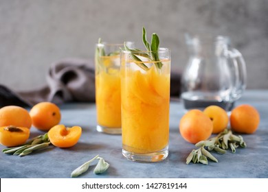 Peach Or Apricot Nectar With Sage In A Glass. Refreshing Cold Drink