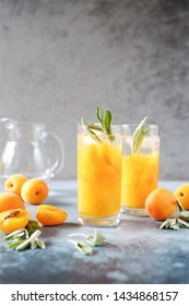 Peach Or Apricot Nectar With Sage In Glass. Refreshing Cold Drink