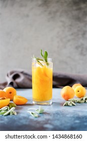 Peach Or Apricot Nectar With Sage In Glass. Refreshing Cold Drink