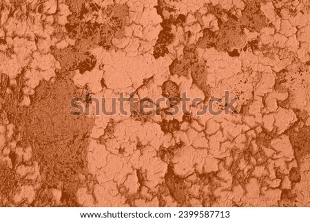 Peach Fuzz wall with dirty scratches and metal stains. Metal rust monochrome background. Color of the 2024 year.