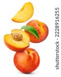 Peach isolated. Whole peach flying with a slice on white background. Falling peach fruit with leaf and cut pieces. Full depth of field.