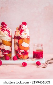 Peach melba sundae in a jar,  with poached peaches, raspberry sauce mascarpone cream and vanilla ice cream