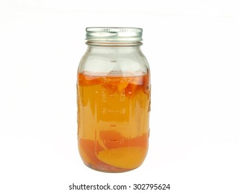 Peach, Strawberry Fruit Flavored Moonshine Alcohol In A Mason Jar