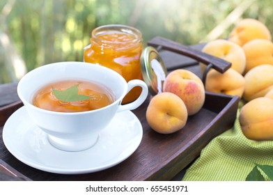 Peach tea and peach fruits with fruit jam, selective focus