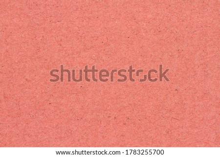 Peach textured cardstock paper closeup background with copy space for message or use as a texture 