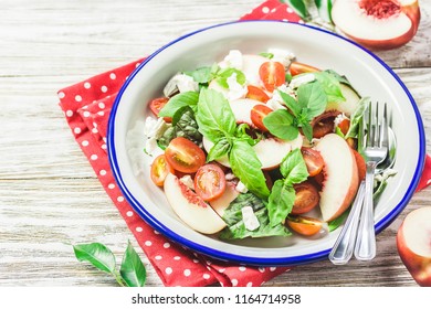 Peach Tomato Basil Salad On White Rustic Background. Top View, Space For Text.