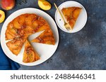 Peach upside-down pound cake on a blue background. Fruit summer desset. Top view. Copy space