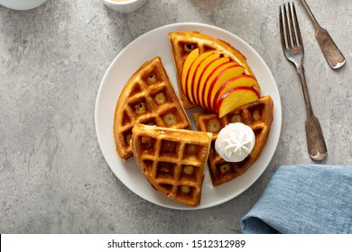 Peach Waffles For Breakfast Served With Fresh Berries, Maple Syrup And Coffee