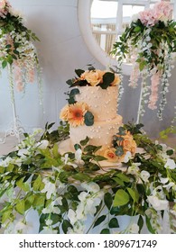 Peach Wedding Cake With Pearls And Fresh Flowers