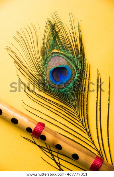 Peacock Feather Bamboo Flute Over Colourful Stock Photo (Edit Now