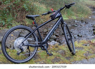 Peak District, United Kingdom - 18th Dec 2021: Carrera Impel im3 Electric Hybrid Bike in black.