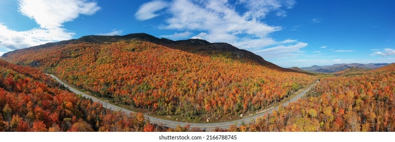 Peak fall foliage in Keene, New York by Cascade Lake.