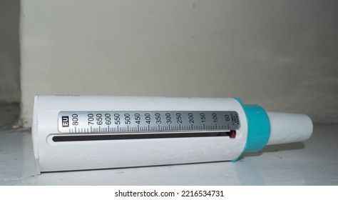 Peak Flow Meter Used To Measure Breathing To Diagnose And Monitor Asthma Isolated On White.