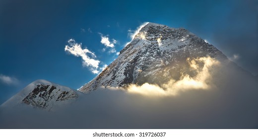 The Peak Of The Highest Mountain In The World - Mt. Everest In The Light Of The First Sunrays.