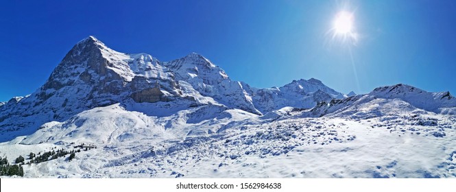The peak of Switzerland Grindelwald snow mountain with blue sky
