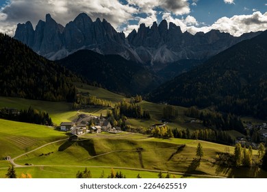 Peaks of the Odle group with village St. Magdalena in autumn, Villnößtal, St. Magdalena, South Tyrol, Italy