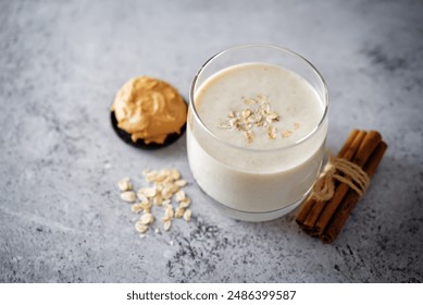 Peanut butter banana smoothie in a glass. toning - Powered by Shutterstock