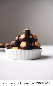 Peanut Butter Chocolate Balls In A White Plate.