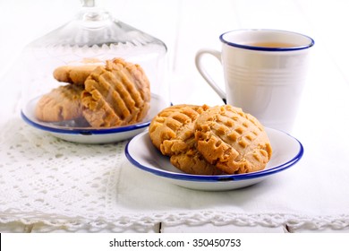 Peanut Butter Cookies On Plate And Cup Of Tea