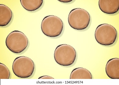 Peanut Butter Filled Candy With Chocolate Frosting Isolated On Yellow