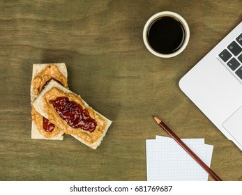 Peanut Butter And Jam Or Jelly With A Cup Of Black Coffee At A Computer Workstation