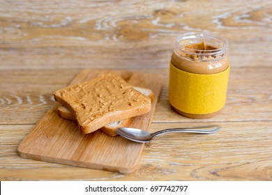 Peanut butter in a jar and toast