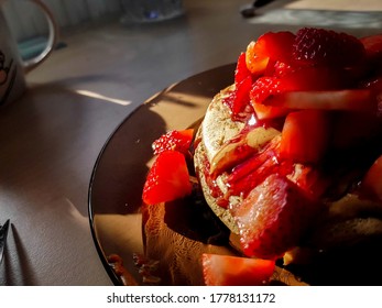 Peanut Butter And Jelly Pancakes Topped With Fresh Strawberries.