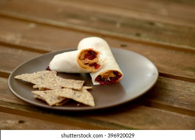 Peanut Butter And Jelly Wrap With Chips On A Plate