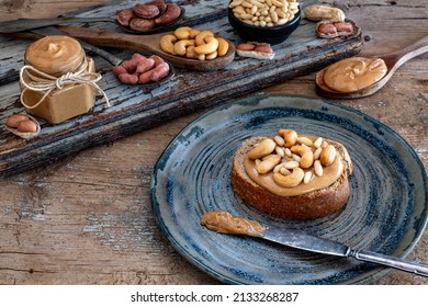 Peanut Butter On The Bread. Serving And Sharing Food With Table Top View. 