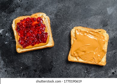 Peanut butter sandwich toast with berry jam. Black background. Top view - Powered by Shutterstock