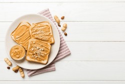 Peanut Butter Sandwiches Or Toasts On Light Table Background.Breakfast. Vegetarian Food. American Cuisine Top View Vith Copy Space.