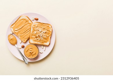 Peanut butter sandwiches or toasts on light table background.Breakfast. Vegetarian food. American cuisine top view vith copy space. - Powered by Shutterstock