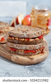 Peanut Butter And Strawberry Jelly Sandwich With Apple