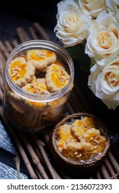 Peanut Cookies Inside Plastic Jar With Dark Background. Eid Hari Raya Cookies