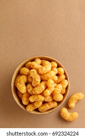 Peanut flips in a bowl viewed from above. Top view. Copy space
