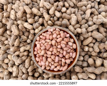 Peanut, groundnut, monkey nut, nut, golden brown colour seeds pods harvest,Dried peanuts. Tasty groundnuts.Background texture of whole natural many peanuts with shell, groundnut at harvest in India