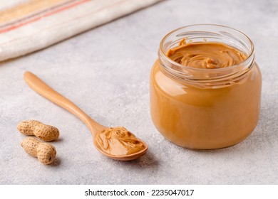 Peanut paste in an open jar - Powered by Shutterstock