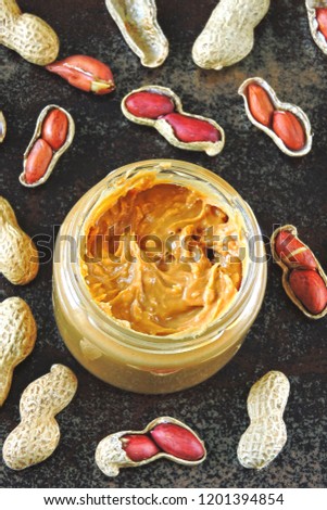 Peanut paste and peanuts. Vegan snack. Keto snack. Vegetable protein concept.