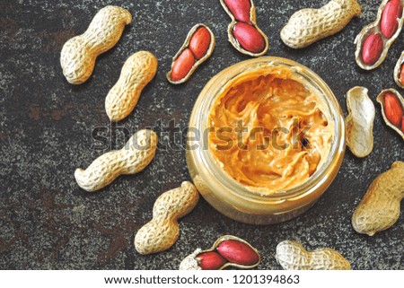Peanut paste and peanuts. Vegan snack. Keto snack. Vegetable protein concept.