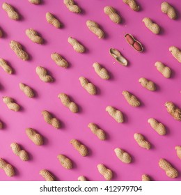 Peanut pattern on pink background. Flat lay. Minimal concept.
