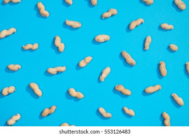 Peanut random flat lay pattern on blue background