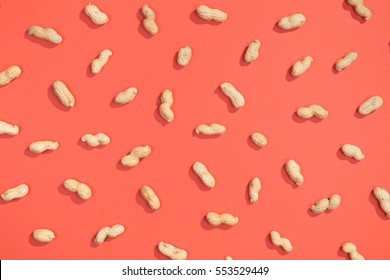 Peanut random flat lay pattern on red background