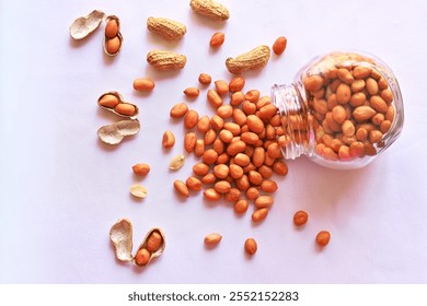 Peanut, shelled nuts, peanut jar, spill, heaped, healthy groundnut  - Powered by Shutterstock