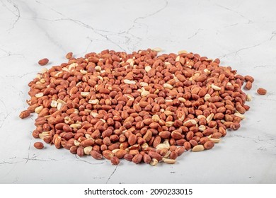 Peanut snack groundnut background pattern. Closeup whole peanut, roasted groundnut snack. Eating peanuts snack food concept. Peeled groundnut heap flat lay background. Salted peanuts top view texture