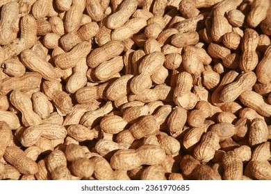 Peanuts. Fresh roasted Peanuts for sale at a Farmers Market. Whole Peanuts in shells. Food and Drink. Peanuts in a barrel. Roasted and Salted. Snack Food. goober. Monkey Nuts. A legume crop. Eat Them.