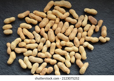 The peanuts, also known as the groundnut, goober, pindar or monkey nut. Commonly known as Legumes, beanor peas. Family Fabacear or Leguminosae. India.