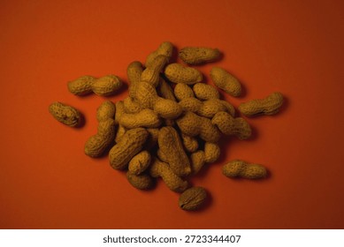 Peanuts on an orange backround.